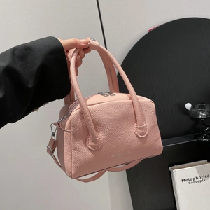 Pink lychee grain PU leather Boston bag with dual zippers and adjustable shoulder strap