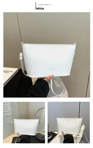 Détails du sac seau blanc à motif litchi avec ferrures dorées et logo embossé