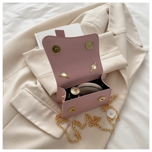 Detail of pink pearl handbag interior with space for lipstick and cosmetics