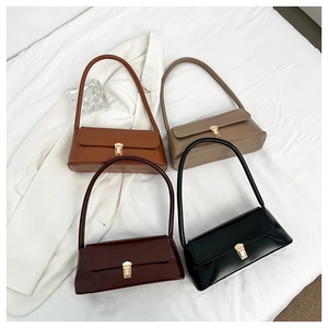 Flat lay of vintage leather underarm bags in brown, khaki, burgundy and black colors