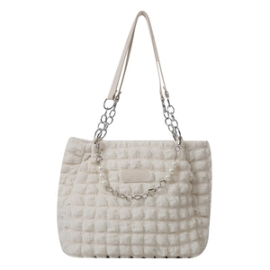 Chic cream bubble-textured tote bag with elegant pearl and metal chain details