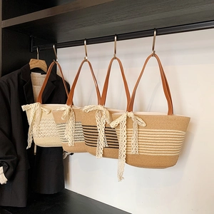Straw woven tote bags with leather straps and lace bows for summer resort style