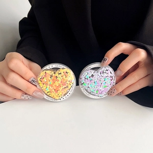 Detail of Magsafe heart phone grip with colorful sequins and Gift For You lettering