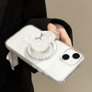 Close-up of heart phone socket with pearl texture and silver bow on clear case