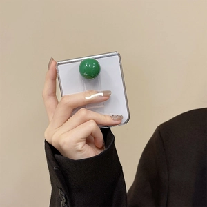 Transparent folding phone case with a unique green spherical ring handle for Samsung Z Flip
