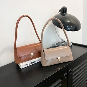 Retro matte leather underarm bag in brown and beige with elegant gold buckle closure