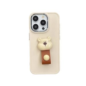 Beige iPhone case featuring a 3D teddy bear and brown leather strap kickstand