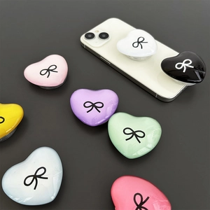 Heart-shaped phone socket with bowknot pattern in various vibrant candy colors