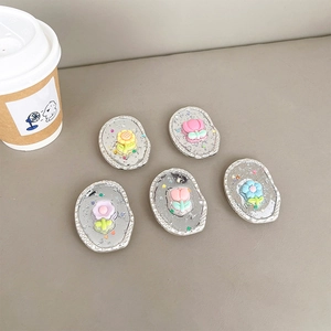 Set of five floral phone grips with glitter resin flowers on silver metal bases