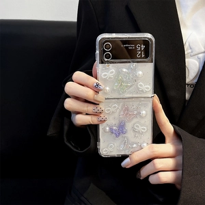 Detail of Galaxy Z Flip case with 3D colorful butterflies and pearl bow accents