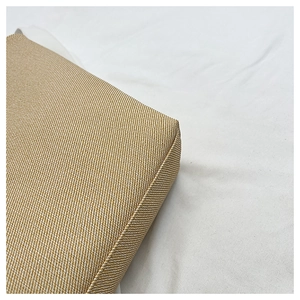 Macro detail of twill woven shoulder bag corner showing brown fabric texture and stitching