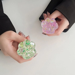 Sparkly sequin cat paw shape collapsible phone grip for desk and hand use, cute pink