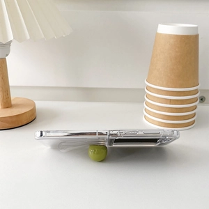 Clear folding phone case for Samsung Z Flip6 with a green round grip stand accessory