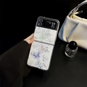 Glittery Samsung Z Flip case featuring 3D iridescent butterflies and elegant pearls