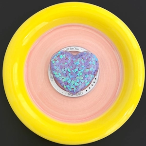 Detail showing heart-shaped Magsafe grip with purple and green sequins inside