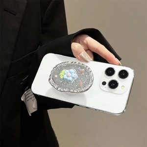 Detailed view of silver hammered cell phone grip with blue glitter flower on iPhone