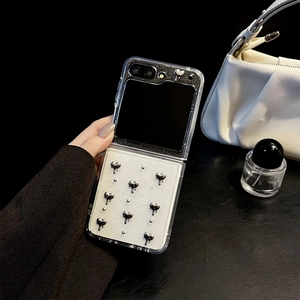 Close-up of clear Samsung Z Flip case with 3D silver hearts and liquid metal texture