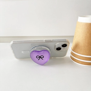 Purple heart-shaped magnetic phone grip with black bow pattern and Gift For You text