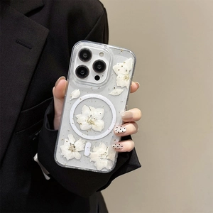 Detail of transparent iPhone case with white dried flowers, gold foil, and MagSafe ring