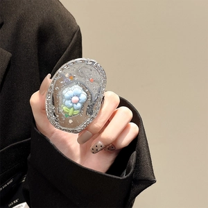 Close-up of glittery resin tulip phone socket with 3D blue flower and silver sparkles