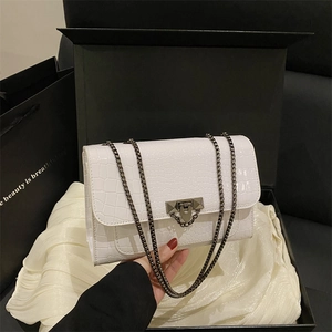 White croc-embossed square crossbody bag with metal chain strap and gift box packaging