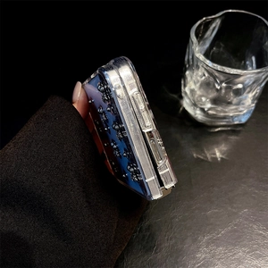 Detailed side view of clear folding case with 3D bears and silver metallic edges
