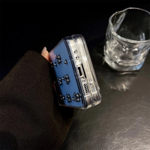 Detail of blue case featuring 3D metallic bears and precise bottom port cutouts