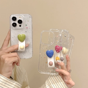 Glitzernde iPhone Hülle mit Silberfolien-Pailletten und bunter Herz-Handschlaufe Halter