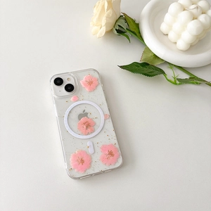 Detail of iPhone case with pink dried flowers, gold foil, and MagSafe magnetic ring