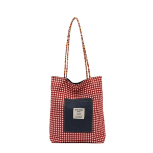 Plaid canvas tote bag with denim front pocket and rainbow straps for daily commuting