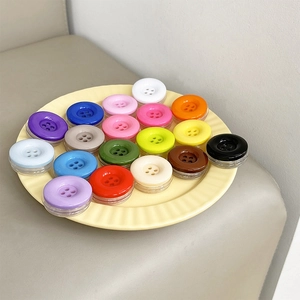 Colorful button-shaped collapsible phone socket stands in eighteen vibrant colors