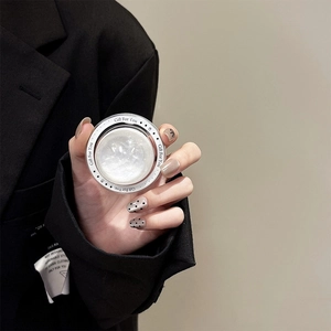 Close-up of pearl white solid balm in round case with Gift For You message