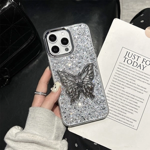 Silver glitter iPhone case with hollow metal butterfly ornament and elegant artistic setup