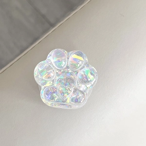 Close-up of iridescent cat paw phone grip with sparkling sequins and heart detail