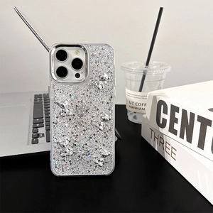 Detail of silver glitter phone case with 3D bears for iPhone 17 Pro Max models