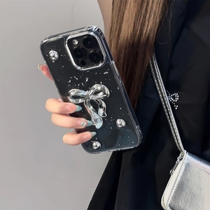 Custodia per iPhone 17 Pro Max glitterata con fiocco d'argento e perline metalliche