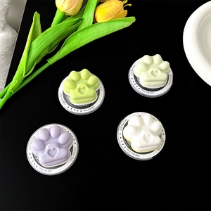 Detailed view of colorful cat paw phone grips in green, purple, and white.