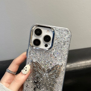 Close-up of silver glitter iPhone case featuring an intricate hollow butterfly metal bracket