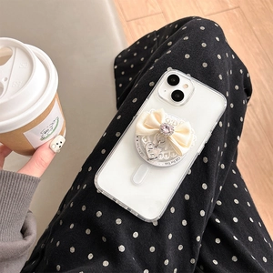 Detailed view of lace bow phone socket with pink rhinestone and silver heart charm