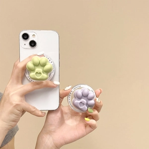 Detailed view of cute 3D cat paw phone stand sockets in green and purple colors.