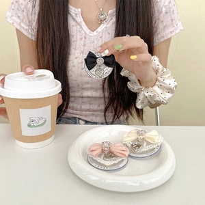 Lace heart-shaped phone grip with satin bow and rhinestone charm in three colors