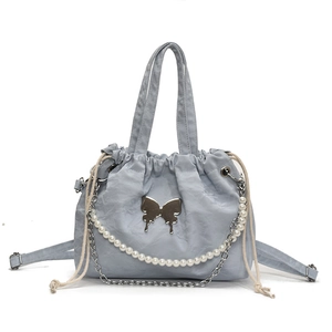 Blue-grey butterfly backpack with pearl chain and adjustable straps on white background