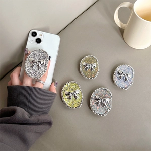 Sparkling glitter bow phone grip socket in various colors for secure handheld support