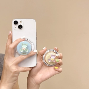 Macro detail of magnetic glitter bear phone grips with transparent resin and bow accents