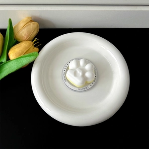 Macro detail of a cute white cat paw phone grip bracket with decorative Gift For You base