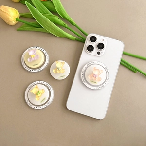 Detailed view of colorful glitter bear phone sockets with cute bowties and magnetic bases