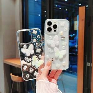 Coque iPhone transparente avec papillons 3D, perles et ornements en forme de cœur