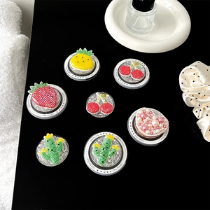 Fruit themed phone socket grip set featuring strawberry and pineapple embroidery designs