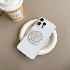White iPhone case featuring a round glitter phone socket with Gift For You text
