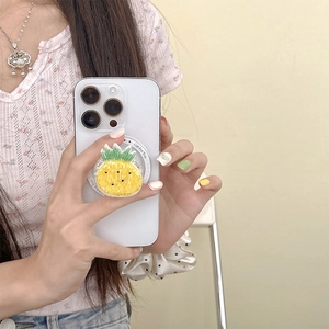 Detailed view of yellow pineapple phone grip with sequins and Gift For You text base